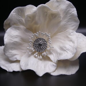 Large white flower with jeweled center